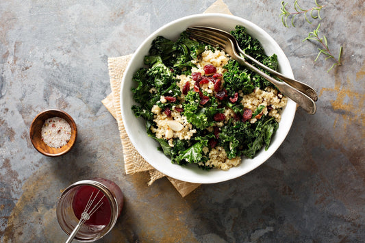 A detail photo of a healthy kale salad. If you've ever wondered if kale makes you gassy, learn more in our complete guide.
