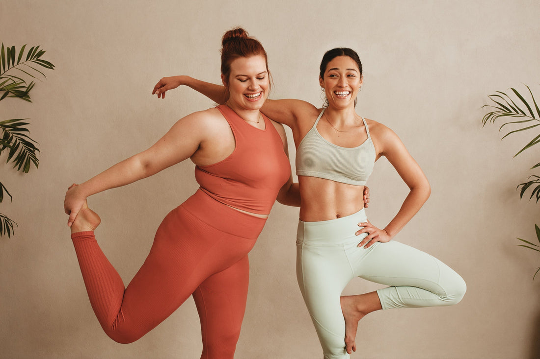 Two women laugh together during exercise. If you've wondered, does Ozempic make you fart, this guide is for you.