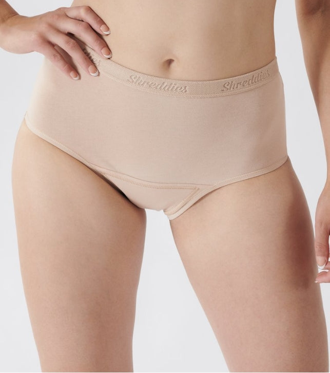 The ladies hi-waist brief fits higher on the waist, above the hips, and lower on the leg than our regular brief. This classic look gives added comfort and confidence a woman needs while still maintaining the flatulence filtering characteristics of Shreddies.