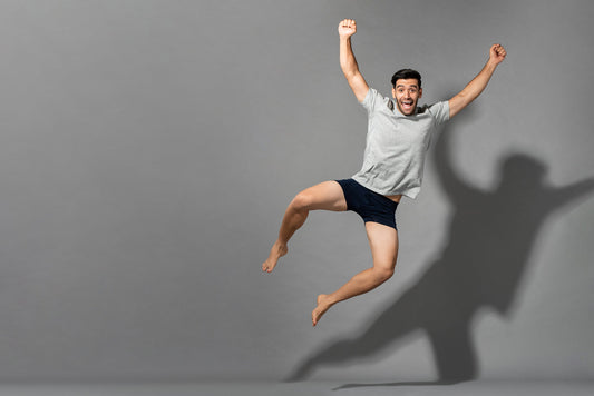 A man jumps for joy in his underwear. This guide breaks down odor control underwear, the technology behind it, and which actually works.