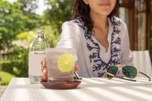 A woman reaches for sparkling water. Sparkling water can cause gas — but the full story is more reassuring. Learn the science, who's most affected, and how to enjoy the fizz without the fallout.