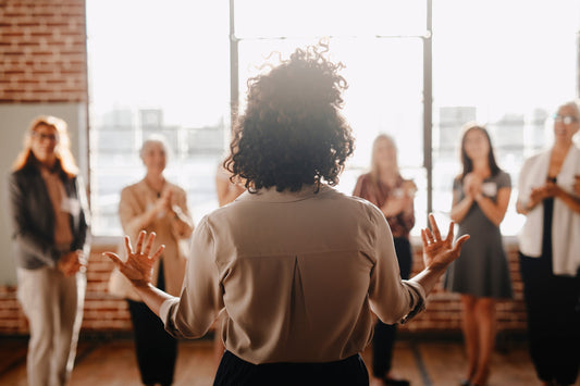  A professional woman leads a presentation at work. Farting at work is one of those universal human experiences that nobody talks about, yet everyone deals with.