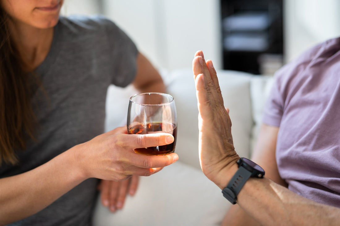 A person holding an alcohol drink. Alcohol gastritis inflames the stomach lining, disrupting digestion for days to weeks. See the symptoms, causes, and proven ways to ease gas and bloating.