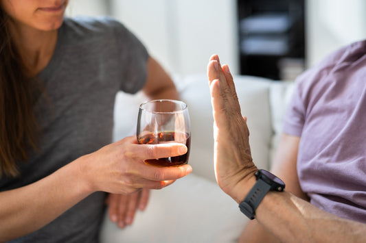 A person holding an alcohol drink. Alcohol gastritis inflames the stomach lining, disrupting digestion for days to weeks. See the symptoms, causes, and proven ways to ease gas and bloating.