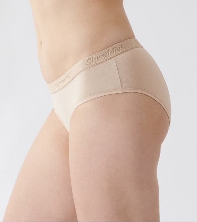 Shreddies Women's Bikini Brief in beige is both fart-filtering and comfortable. Made with activated carbon cloth to absorb and eliminate flatulence odors, Shreddies underwear offers freedom for sufferers of IBS, Crohn’s disease, colitis, dyspepsia, gastritis, food intolerances and other bowel & digestive disorders.